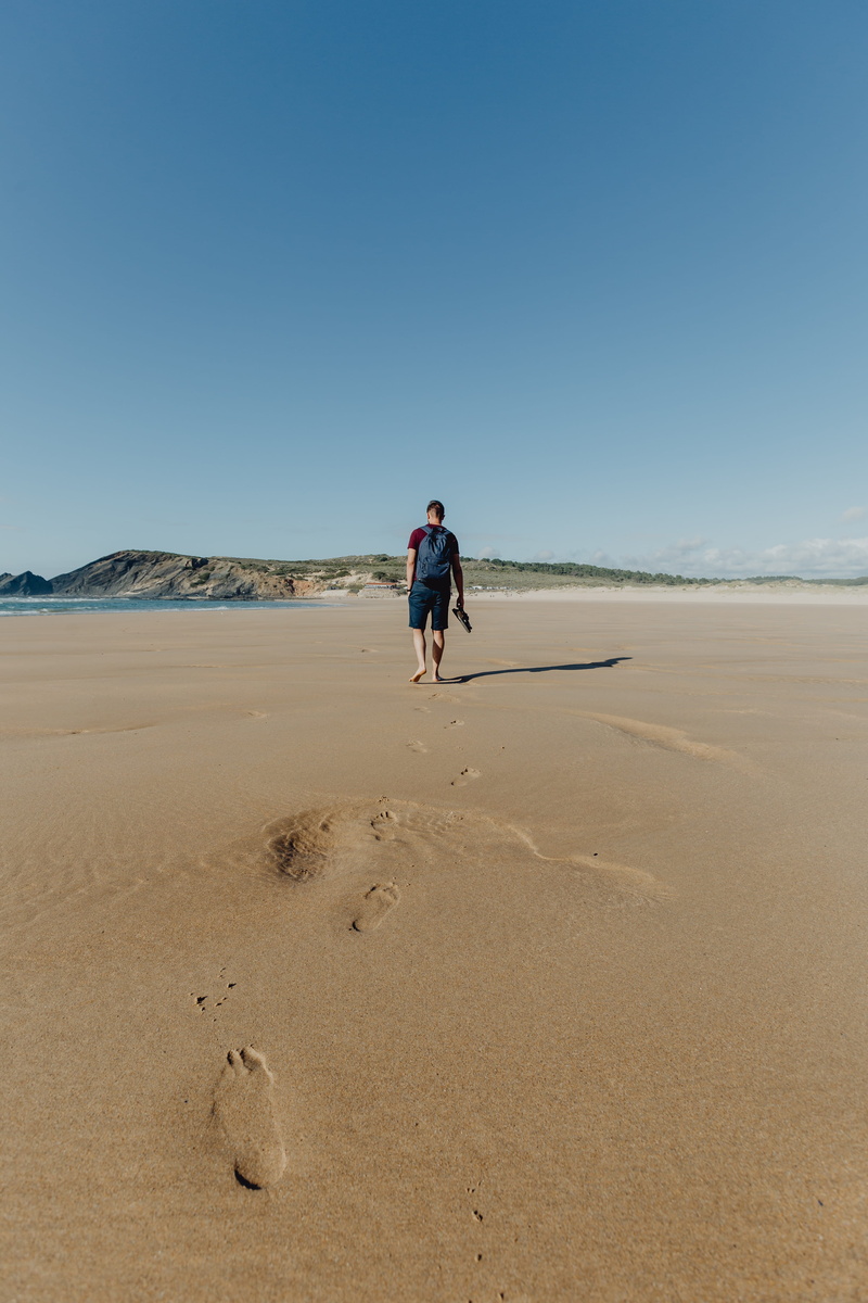 leisure activity, sandy, portugal, real people, land, sea, scenics - nature, walking, clear sky, beach, outdoors, algarve, men, arid climate, copy space