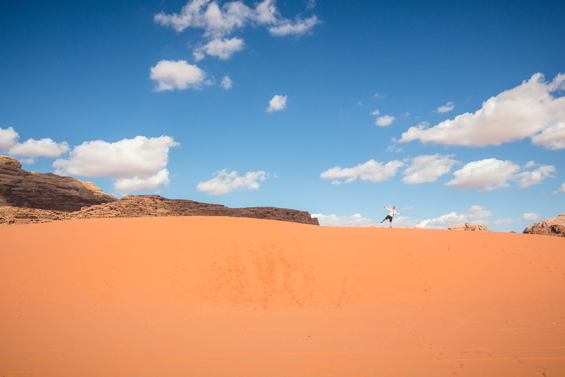 jordan, leisure activity, desert, tranquility, tranquil scene, environment, sand dune, sky, land, sand, cloud - sky, landscape, man, wadi rum, nature, climate
