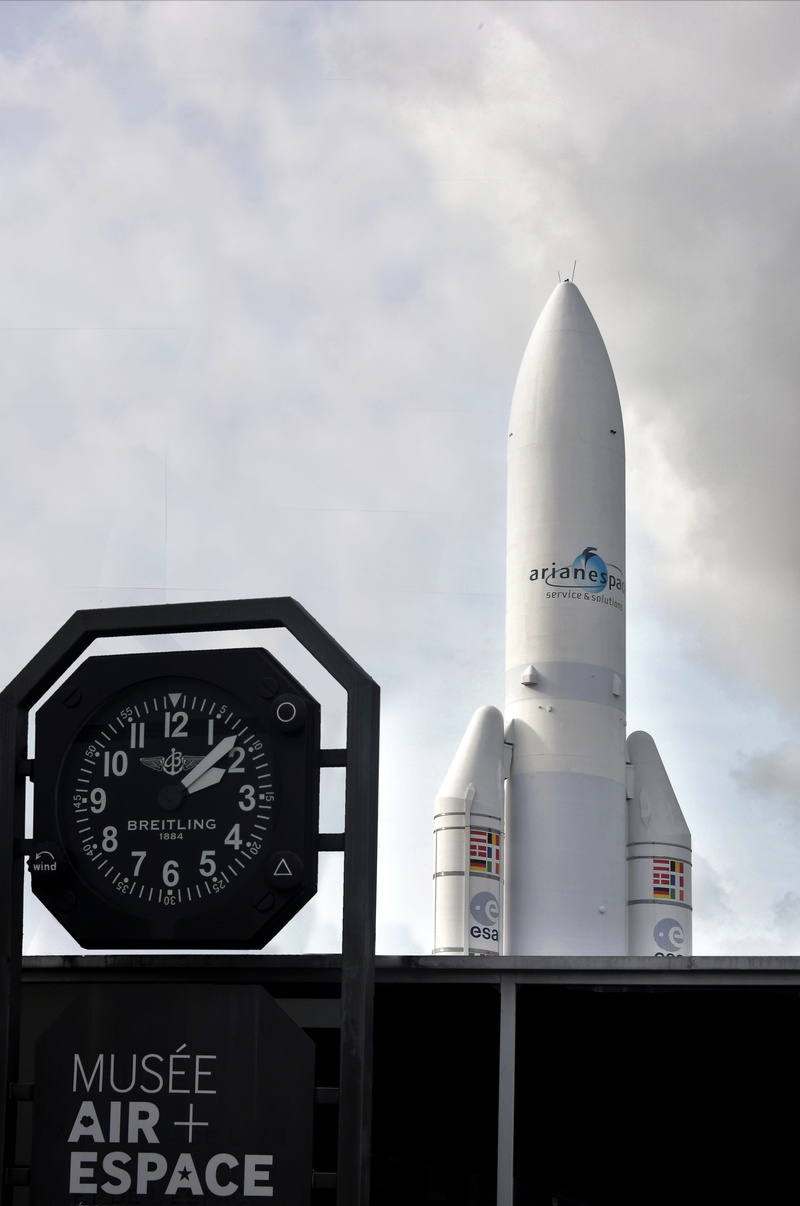 outdoors, air, esa, satellite, cloud - sky, architecture, nature, western script, built structure, control, no people, launcher, ariane v, text, day, tower