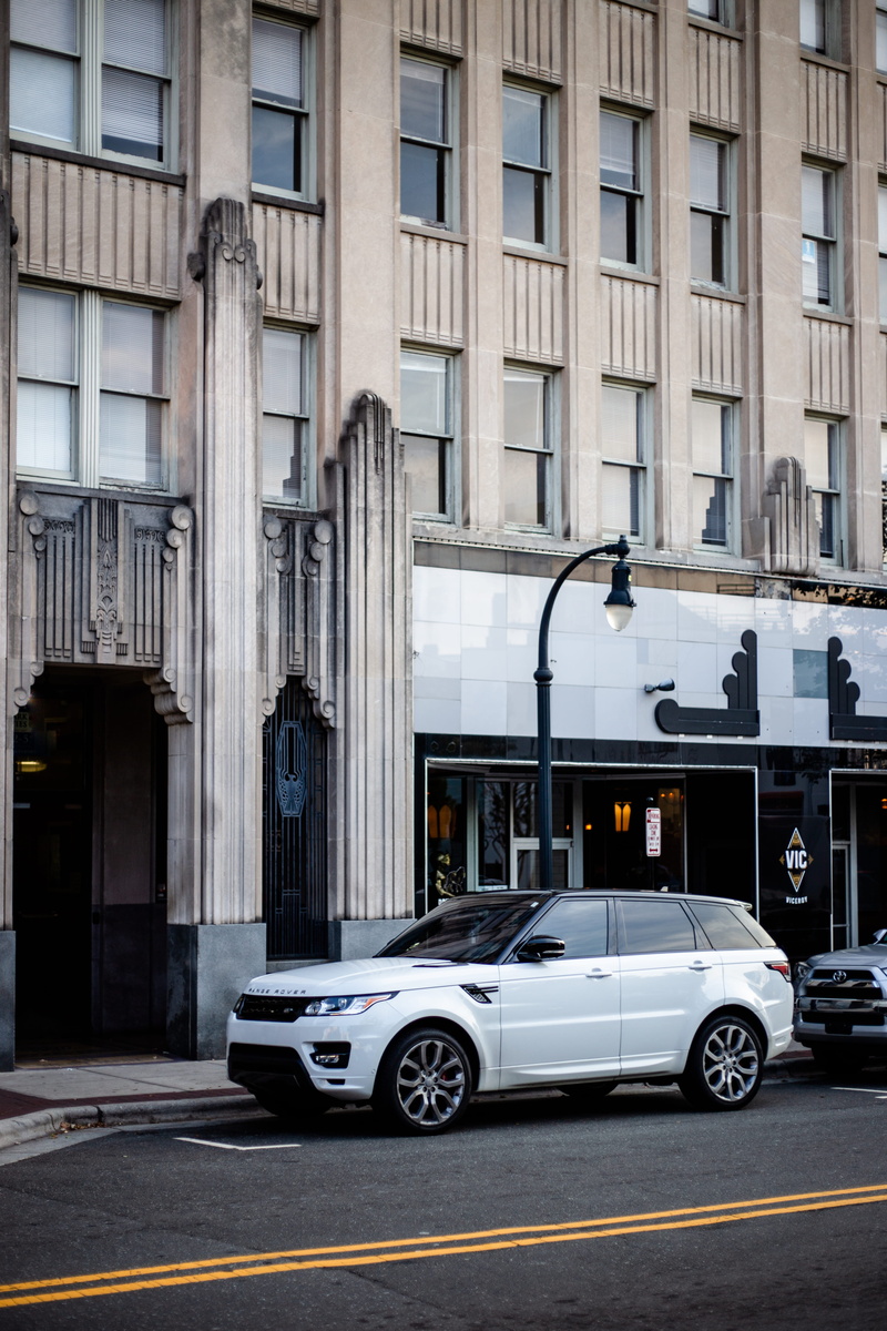 white, lamp, residential district, land, parking, built structure, suv, parked, no people, car, motor vehicle, street light, building, line, transportation