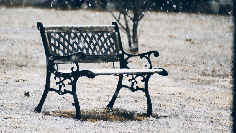 empty, table, outdoors, cold temperature, day, top, wood - material, black, park bench, glass, focus on foreground, white color, field, framed, snowing