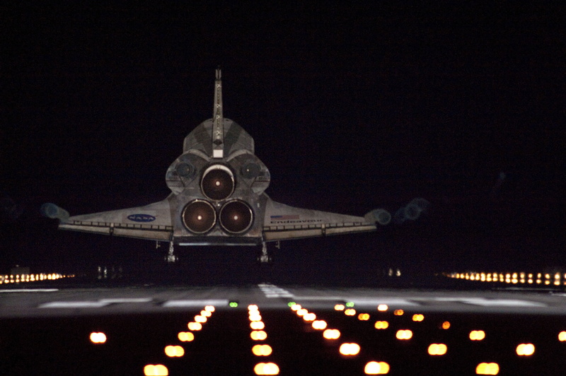 building exterior, illuminated, landing, travel, spire, astronaut, airplane, motion, outdoors, flight, air vehicle, exploration, sky, mission complete