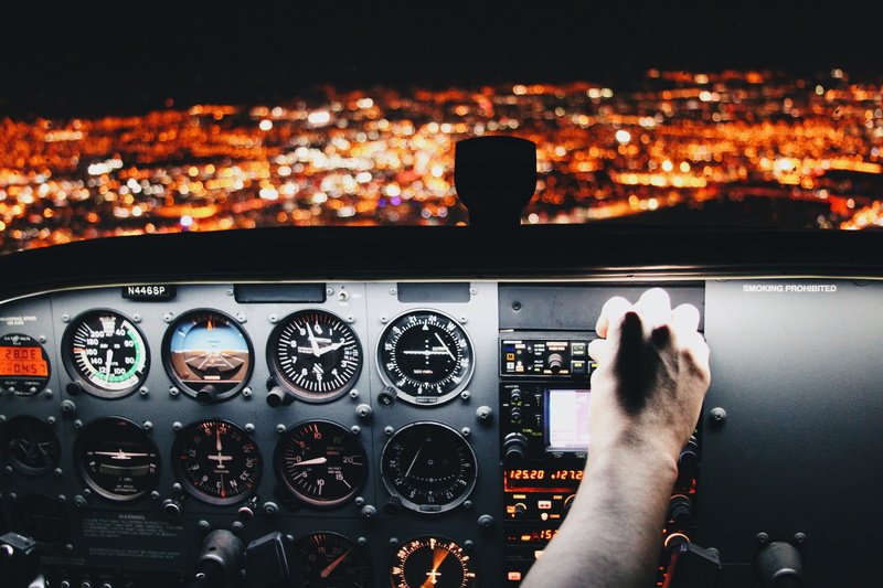 mode of transportation, dashboard, cockpit, people, plane, technology, operating, hand, control, travel, dark, airplane, human hand, control panel, lights