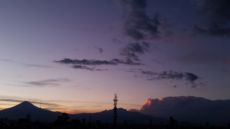 beauty in nature, nimbus, cloud - sky, orange color, popocatepetl, built structure, cloud, nature, tranquil scene, dramatic sky, idyllic, outdoors, no people