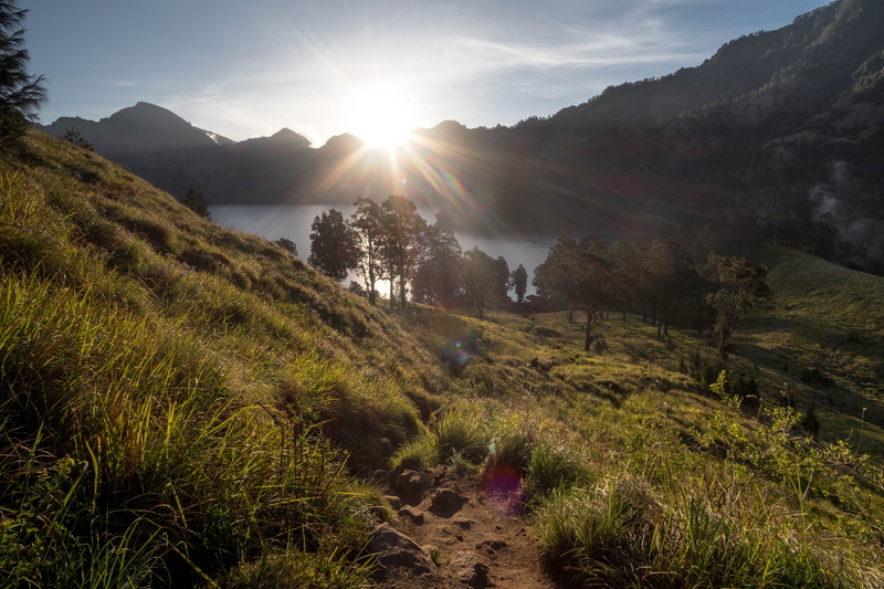 plant, sunlight, non-urban scene, lake, land, sunset, mountain range, mount rinjani, outdoors, no people, bright, landscape, beauty in nature, tranquil scene