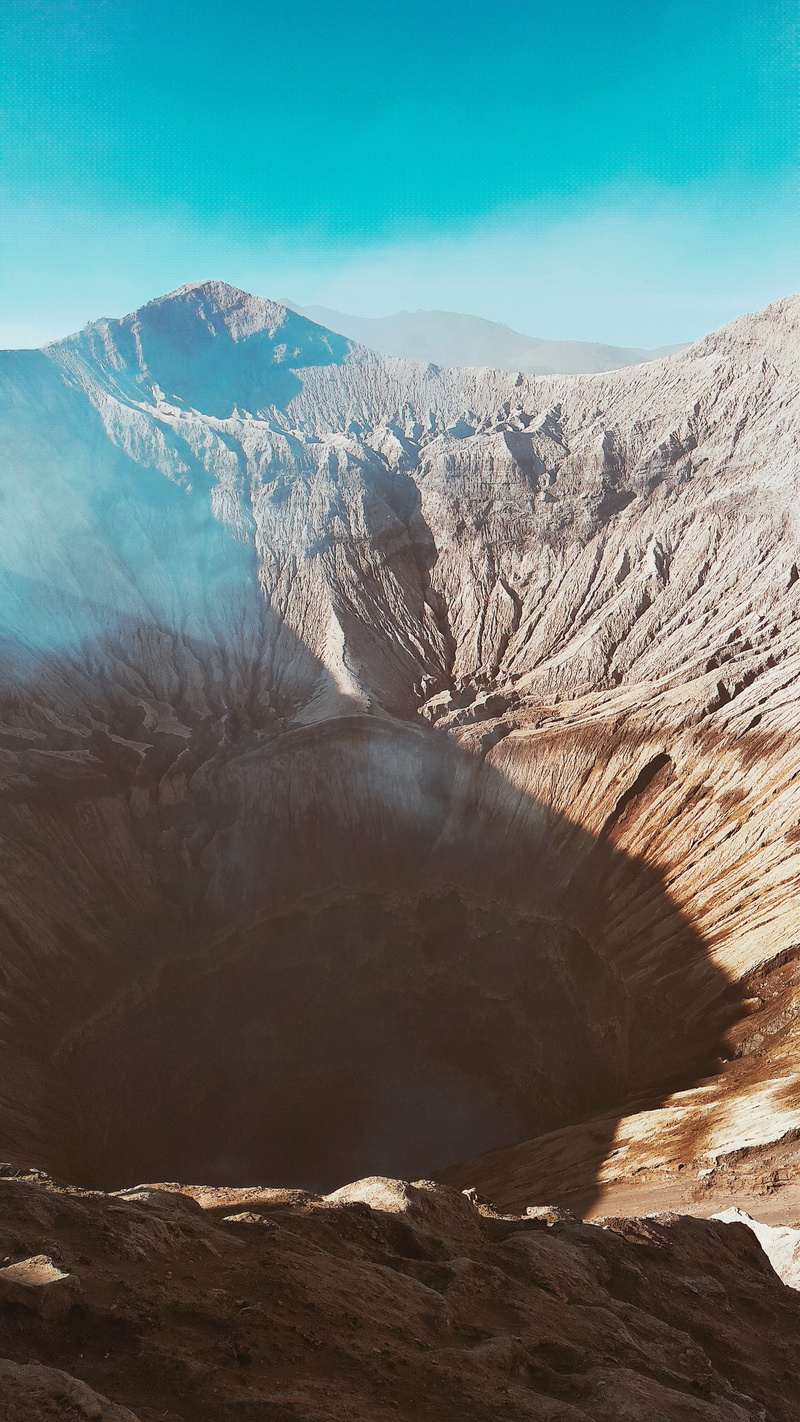 crater, physical geography, plateau, nature, mist, animal, shadow, rock, arid climate, formation, sky, tranquil scene, mountain range, volcano, no people