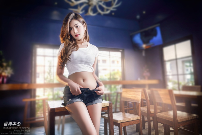 seat, looking at camera, focus on foreground, Women, beautiful woman, hairstyle, young women, front view, crop top, portrait, young adult, lifestyles, contemplation