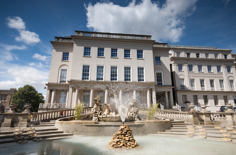 building exterior, outdoors, fountain, incidental people, building, cloud - sky, cheltenham, city, water, splashing, day, 2K, regency, sky, tree, architecture
