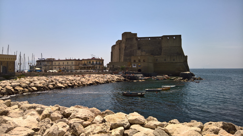naples, no people, sunlight, napoli, clear sky, building, ovo castle, 5K, building exterior, solid, architecture, rock - object, boats, sky, day, italy