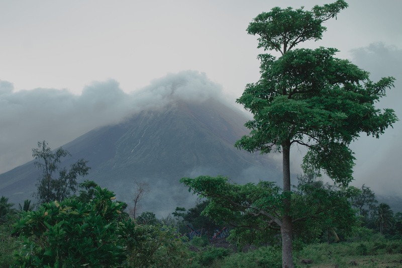 mountain peak, outdoors, mountain, plant, smoke - physical structure, sky, tranquil scene, scenics - nature, power in nature, non-urban scene, trees, no people