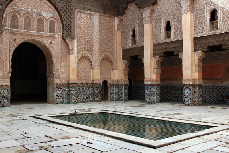 tiled floor, building, travel, outdoors, courtyard, arcade, no people, reflection, built structure, columns, brown, the past, arch, stone, tourism, mosaic