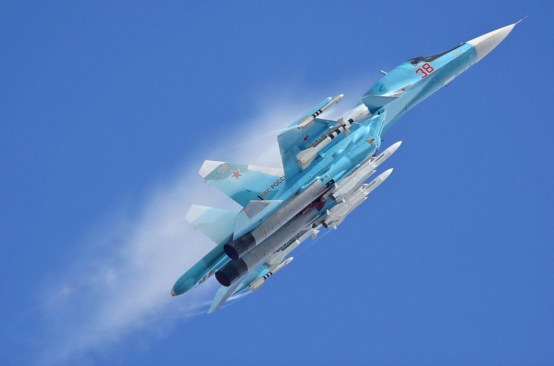 mode of transportation, clear sky, outdoors, motion, plane, two objects, no people, mid-air, low angle view, blue, transportation, sukhoi su 30, above
