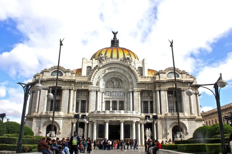 sky, religion, sculpture, building exterior, tourist, music, large group of people, travel destinations, painting, opera, palacio bellas artes, real people