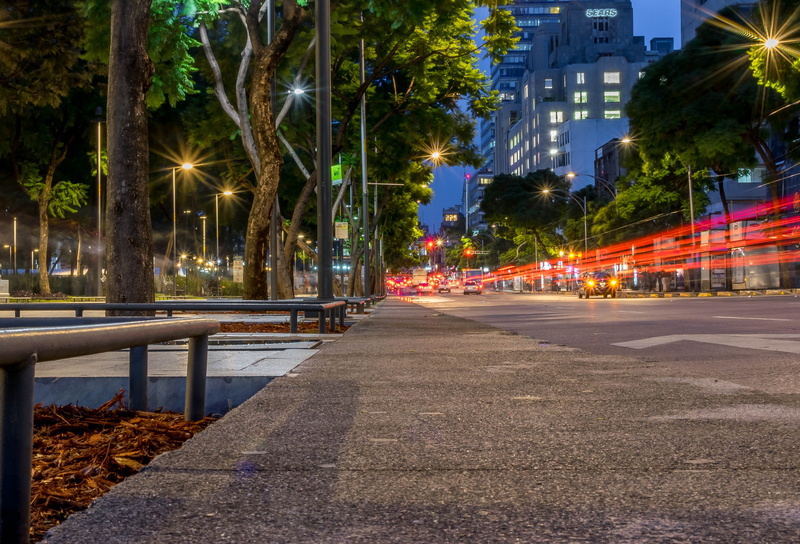 outdoors, horizon, light, building, light trail, motor vehicle, motion, road, illuminated, city street, car, plant, built structure, night, no people, tree