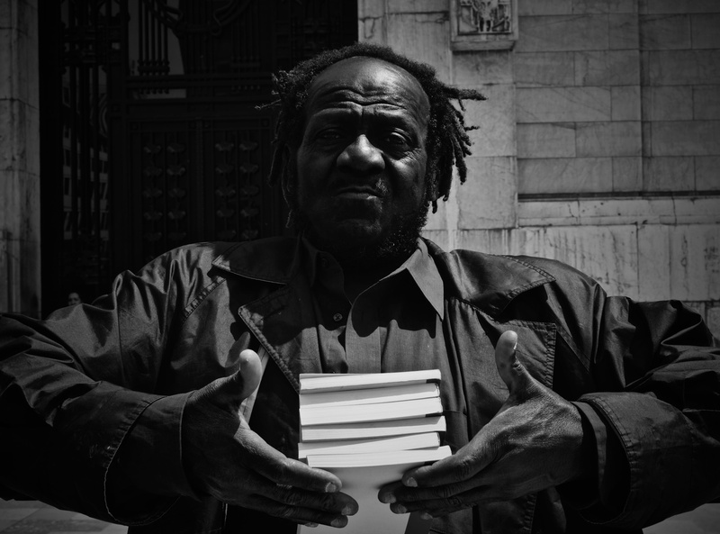 real people, palacio de bellas artes, waist up, one person, sitting, males, book, portrait, lifestyles, men, ciudad de méxico, publication, mature men