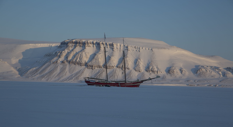 land, dune, snow, winter, beauty in nature, body, non-urban scene, nautical vessel, clear sky, mountain, ship, day, transportation, no people, water, white color