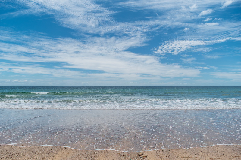 seashore, beauty in nature, scenics, sea, wave, cloud - sky, tranquility, idyllic, cumulonimbus, outdoors, seascape, motion, beach, water, horizon, ocean