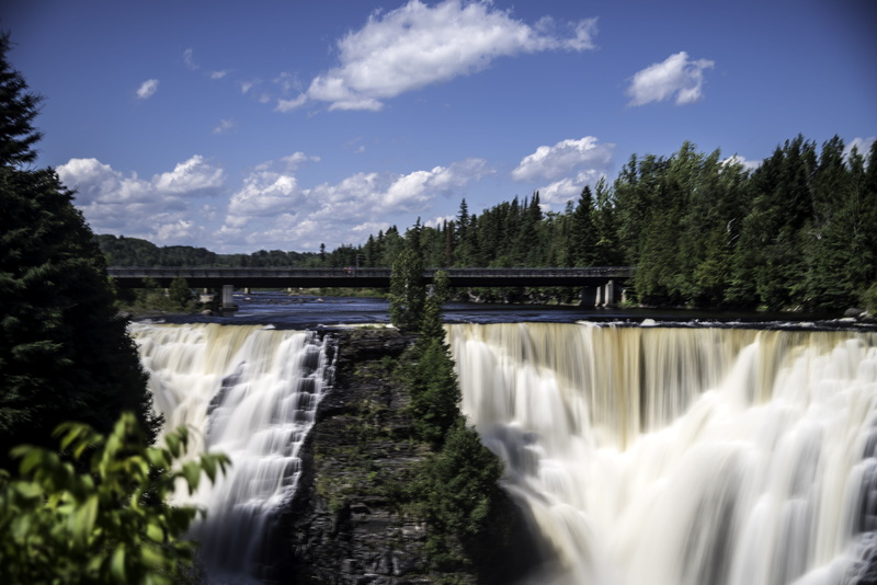 falling, bridge - man made structure, plant, motion, Kakabeka Falls, scenics - nature, landscape, blurred motion, outdoors, scenics, flowing, river, Canada
