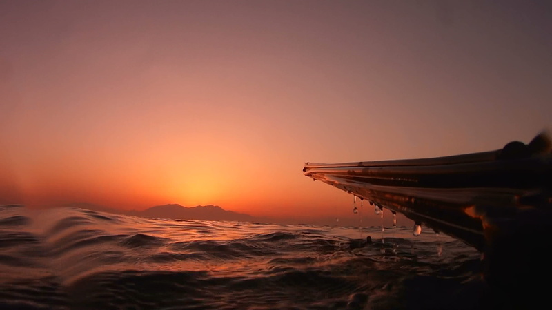 tranquility, water, red, sunrise, horizon, copy space, no people, ocean, wave, boat, orange color, island, scenics - nature, outdoors, non-urban scene