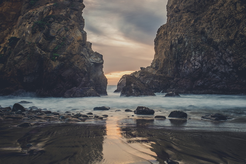 sky, rock, formation, solid, non-urban scene, land, mist, beach, eroded, brown, water, rock - object, sea, outdoors, idyllic, tranquility