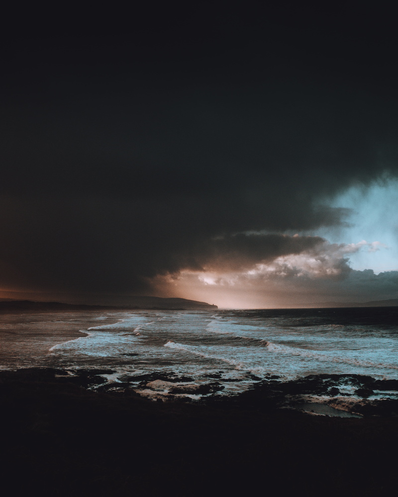 outdoors, cloud - Sky, ominous, sky, dramatic Sky, power in nature, coastline, cloudscape, rock - Object, waters Edge, sunlight, black, beauty In Nature