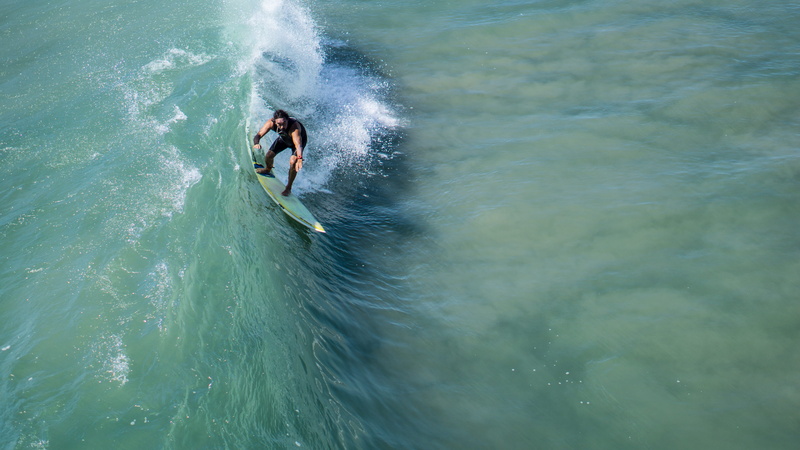 nature, sea, lifestyles, outdoors, surfer, wave, motion, power in nature, adventure, beauty in nature, man, high angle view, transportation, aquatic sport