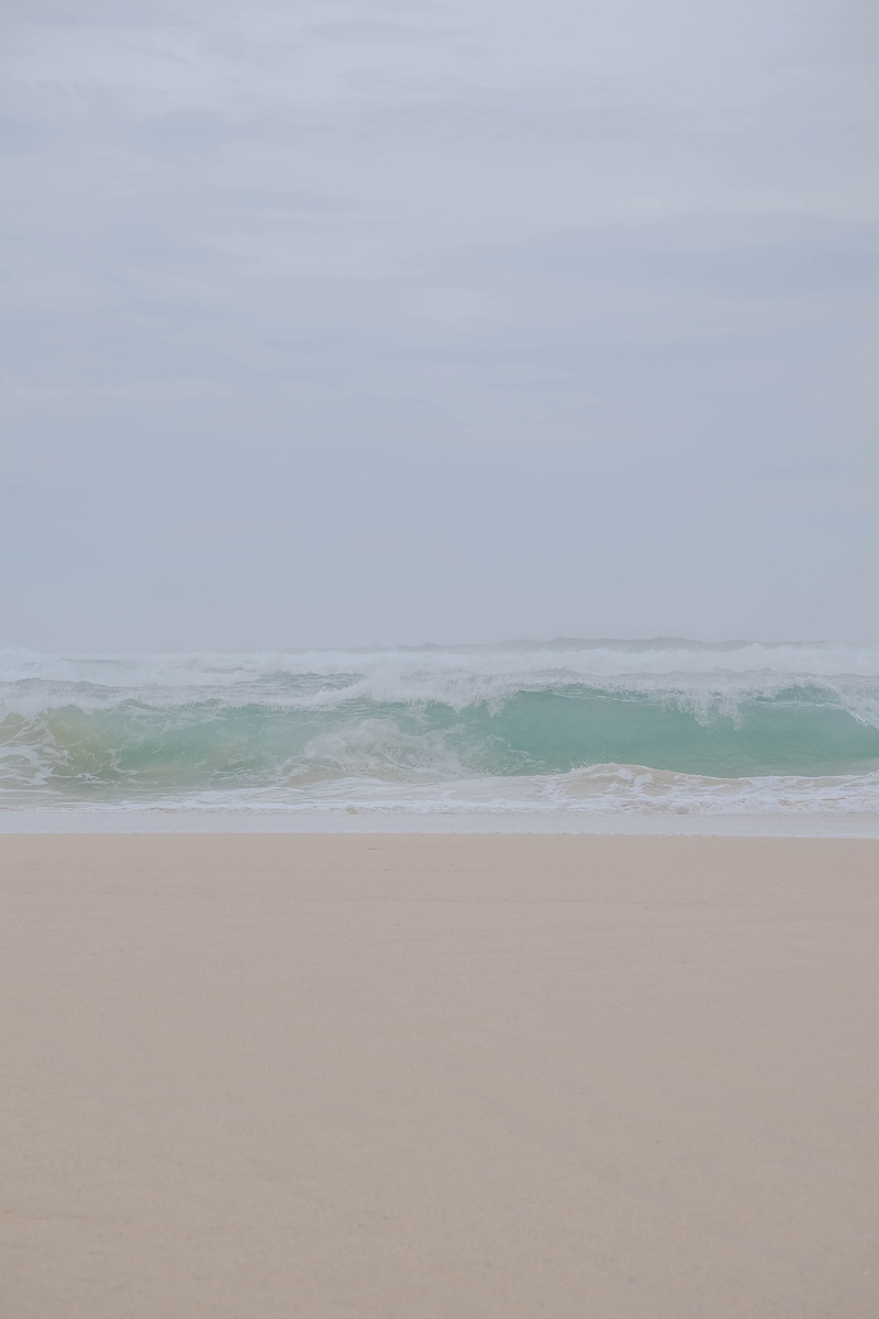 sky, island, tranquility, beach, beauty in nature, day, tranquil scene, motion, belle ile en mer, pastel, horizon over water, turquoise, seaside, outdoors
