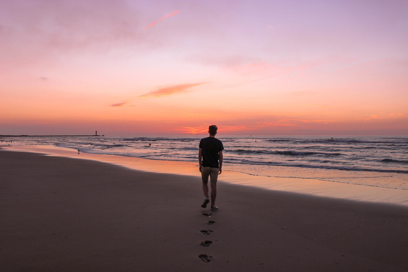 shore, water, sunset, standing, travel, exercise, working out, silhouette, motion, fitness, apparel, sea, person, full length, nature, beauty in nature