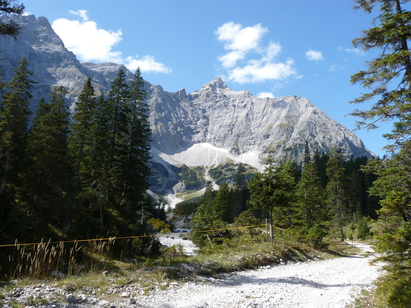 riverbed, tranquility, day, snow, beauty in nature, hiking, cloud - sky, non-urban scene, landscape, water, sky, mountains, mountain range, outdoors, plant