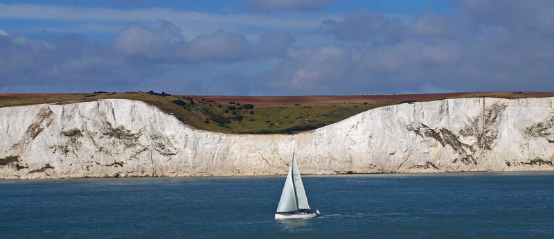 yacht, sailing boat, beauty in nature, sailing, travel, transportation, no People, scenics, nautical Vessel, outdoors, land, cliff, England, cliffs, mountain