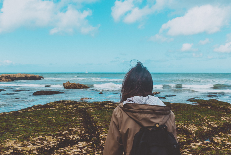 beauty in nature, girl, zara, beach, lifestyles, sky, real people, land, europe, hair, la manche, stones, one person, wind, nature, lichen, leisure activity