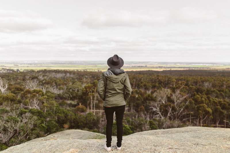 hood - clothing, rear view, land, person, cliff, solitude, trees, daylight, hooded shirt, view, vegetation, scenics - nature, landscape, hill, cloud - sky