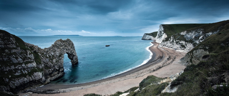 sky, solid, coast, scenics - nature, body, Durdle Door, rock, coastline, rock - object, beside, cliff, horizon over water, water, beach, landscape, outdoors