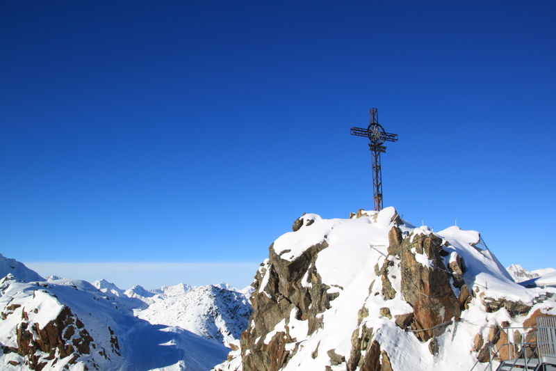 sky, height, cross, snow, no people, day, blue, mountain, wide, nature, rock, alpine, tyrol, beauty in nature, panorama, mountain Peak, mountain range