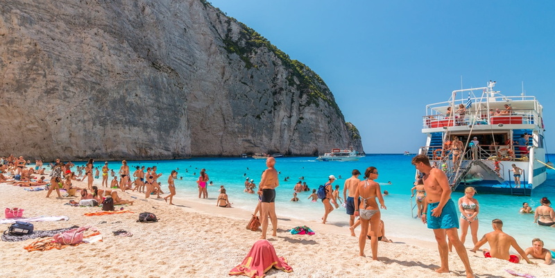 adult, travel destinations, group of people, water, lifestyles, ocean, sky, holiday, land, greece, trip, beach, 1080P, sand, crowd, sea, outdoors, summer