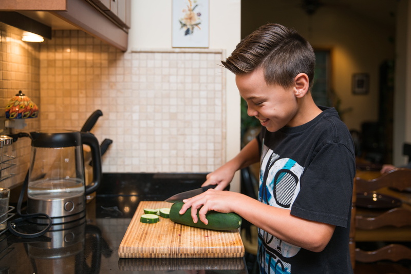 indoors, lifestyles, preparing food, home, Happy, casual clothing, Cooking, Fun, looking, waist up, childhood, domestic room, domestic kitchen, pre-adolescent child