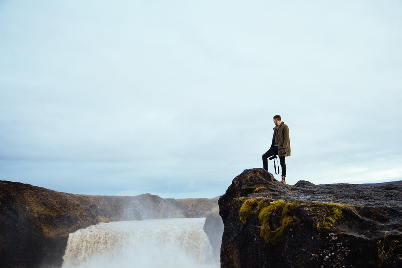 lifestyle, water, 25-30 year old, one person, rock, rock - object, standing, tourism, adventure, environmentalist, cloud - sky, extreme, outdoors, camera