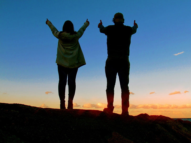 rear view, leisure activity, two people, arms raised, beauty in nature, human arm, outdoors, support, standing, nature, men, togetherness, sunset, real people