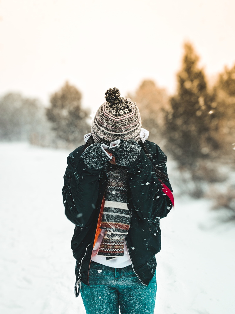 plant, snow, black, blizzard, outdoors, zip, tree, standing, land, one person, real people, human, yosemite, hat, clothing, bobble, three quarter length