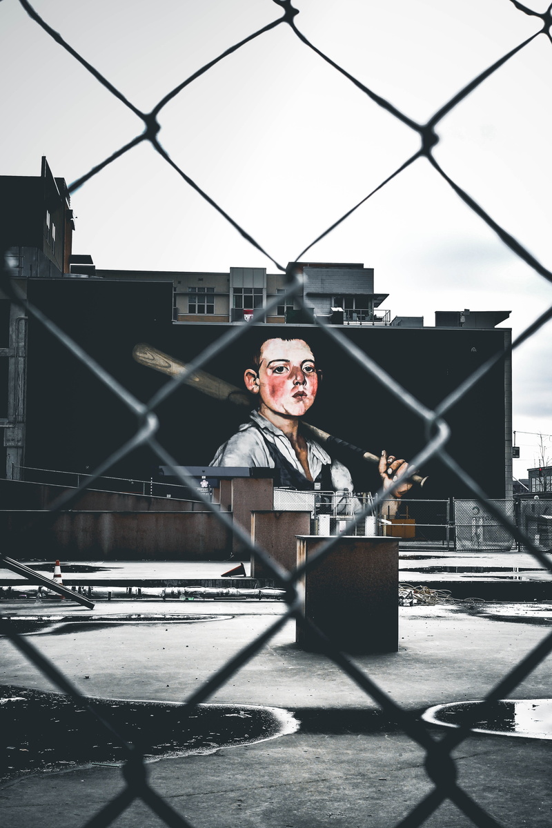 billboard, looking at camera, lifestyles, winter, downtown cincinnati, canon, young adult, urban, boundary, one person, outdoors, baseball bat, barrier
