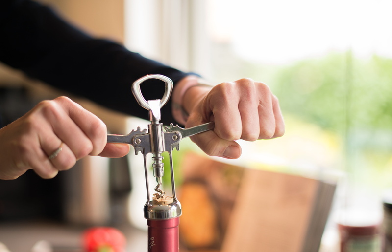 finger, real people, unrecognizable Person, holding, cork, alcohol, drink, day, hand, one Person, spiral, equipment, tool, metal, adult, adults only, stainless