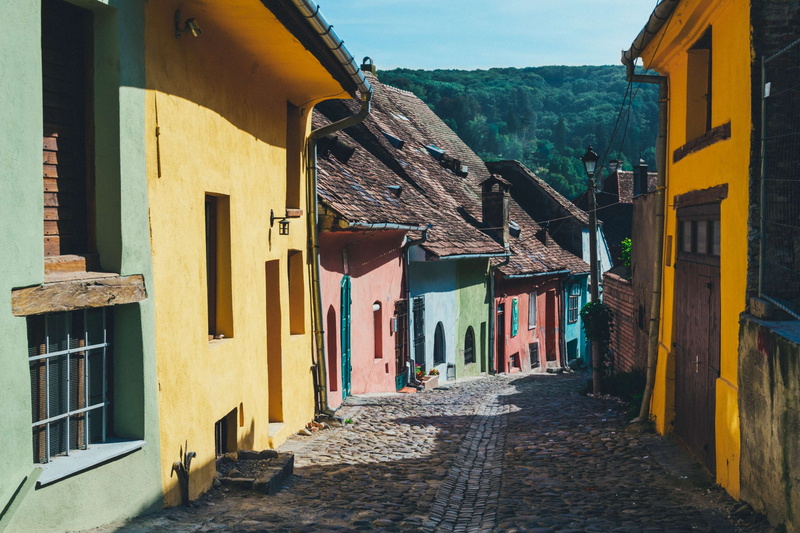 town, architecture, building exterior, outdoors, facade, alley, direction, mountain, 4K, building, nature, tourism, city, day, travel, street, home, narrow