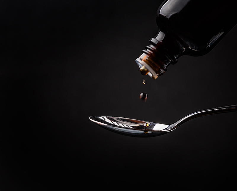 food, indoors, drop, food and drink, eating utensil, cough syrup, studio shot, communication, bottle, copy space, fever, hospital, close-up, medical, winter