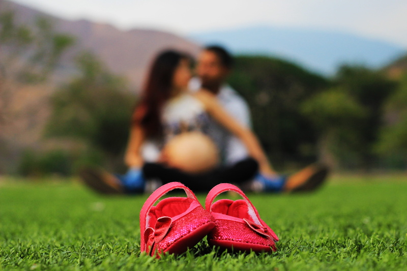 father, shoe, child, togetherness, grass, young adult, pregnancy, family, outdoors, men, heterosexual couple, pregnant, love, focus on foreground, belly