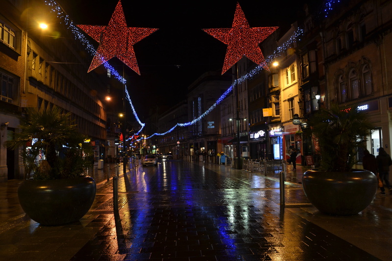 rain, road, outdoor, stars, direction, scene, wet, night, street, residential, high street, city, nighttime, raining, illuminated, decoration, built structure