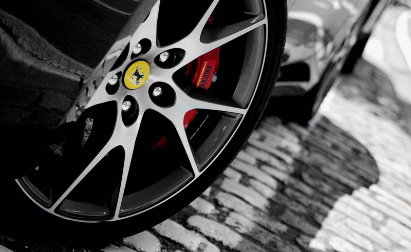 outdoors, motor vehicle, transportation, tire, Cars, speed, pattern, t, focus on foreground, vehicle part, sports car, spoke, close-up, Wheel, car, high angle view