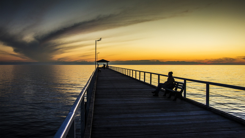 sunrise - Dawn, person, bench, sun, pier, sunset, beach, dusk, tranquil Scene, water, outdoors, 2K, travel, sitting, ocean, sunlight, sunset  beach, facing