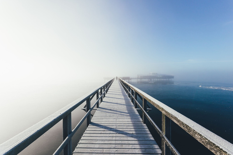 outdoors, diminishing perspective, bridge - man made structure, water, built structure, railing, scenics - nature, fog, landscape, connection, bridge, sea