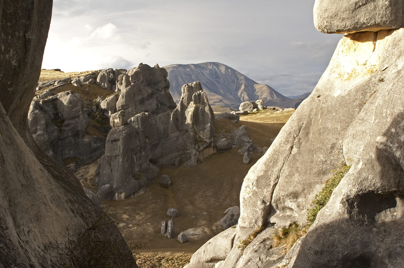 formation, rock, cliffside, outdoors, beauty in nature, new zealand, grass, mountain range, valley, cloud - sky, 1080P, non-urban scene, rock - object