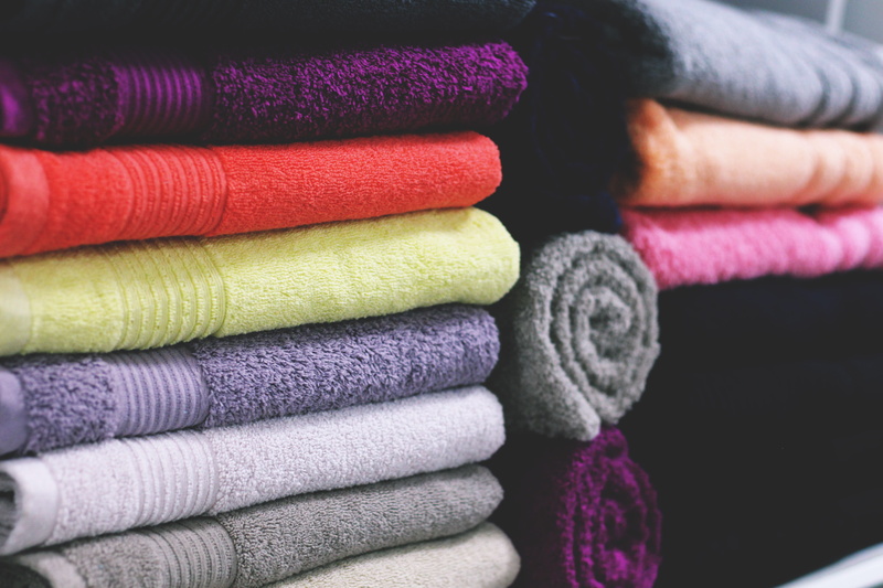 focus on foreground, human body part, art and craft, group of objects, warm clothing, wool, thread, choice, bath, purple, order, towels, softness, various